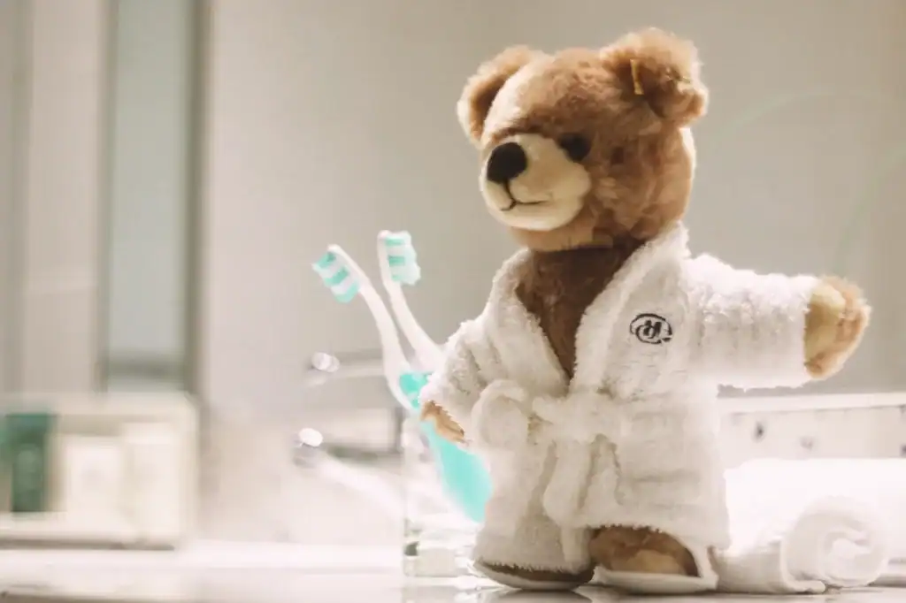 brown-teddy-bear-in-a-bathroom-in-a-hilton-hotel-2024-10-14-02-02-48-utc