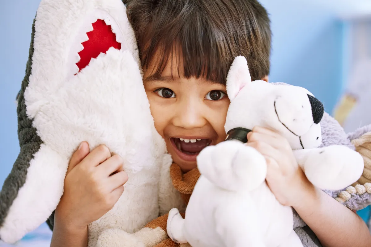 portrait-of-an-adorable-little-boy-playing-with-hi-2025-04-06-08-23-20-utc